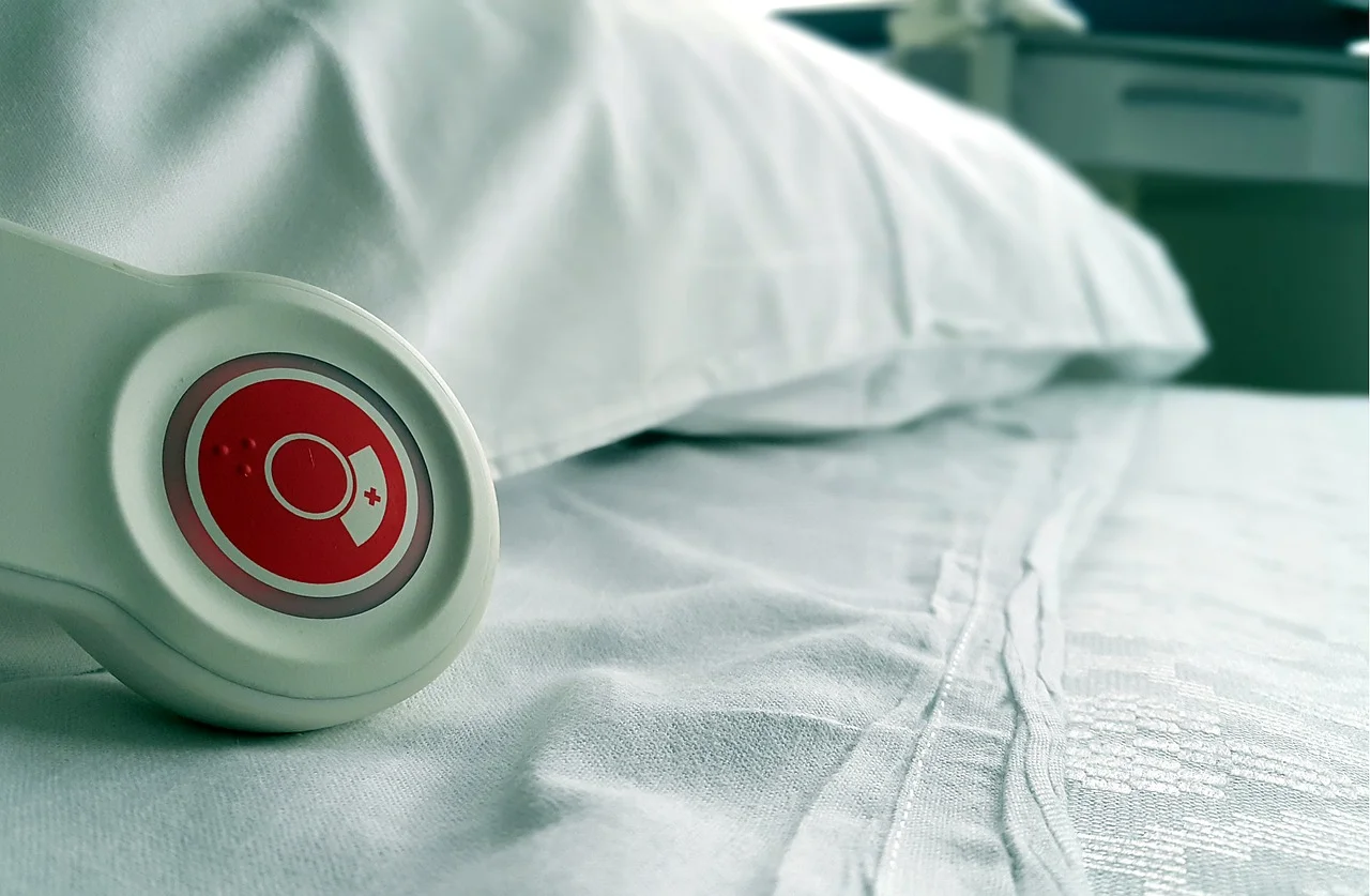 Nurse call button on top of hospital bed